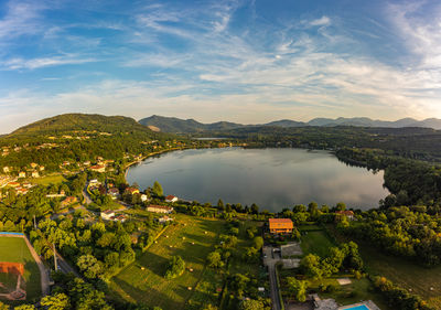 High angle view of townscape by sea against sky