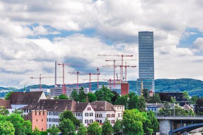 Buildings in city against sky