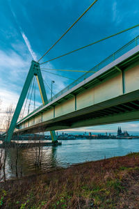 Low angle view of bridge over calm river