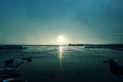 Wet san francisco international airport against blue sky during sunset