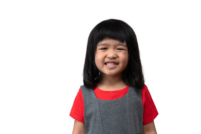 Portrait of smiling boy against white background