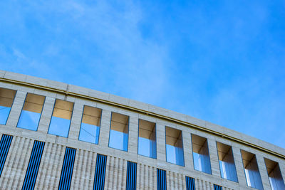 Low angle view of building against blue sky