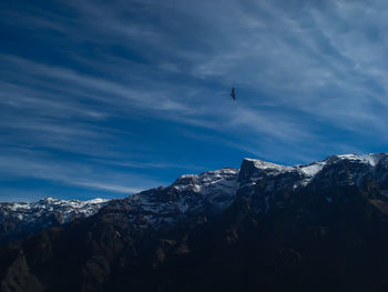 Scenic view of mountains against sky during winter