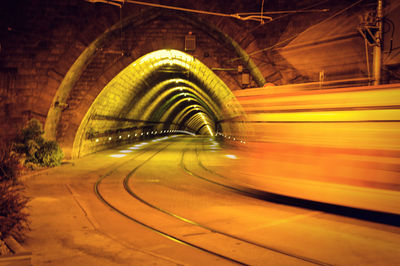 Long exposure of train in illuminated tunnel