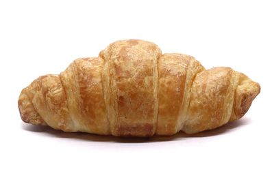 Close-up of bread against white background