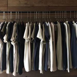 Clothes hanging in row at store