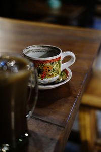 Close-up of coffee served on table