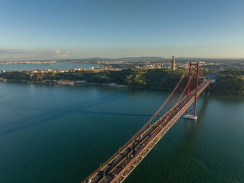 The 25 april bridge  ponte 25 de abril located in lisbon, portugal, crossing the targus river.