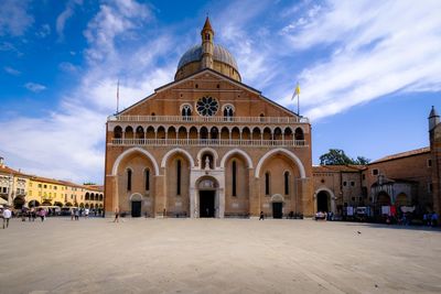 Group of people in front of historic building