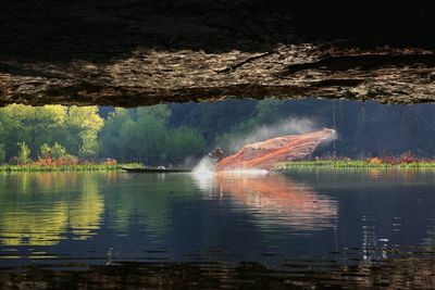 Fisherman casting fishing net