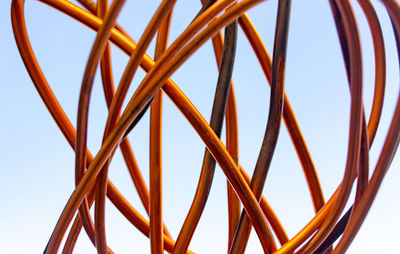 Low angle view of metallic structure against clear sky