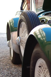 Close-up of vintage car on road