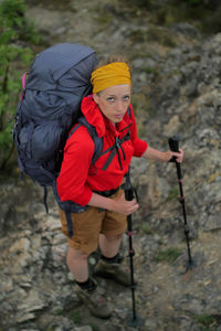 Full length of woman holding umbrella