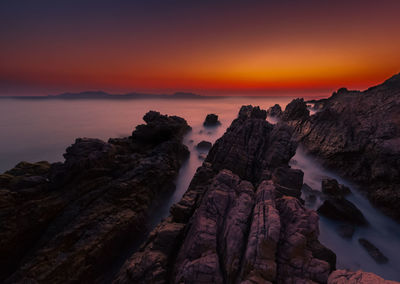 Scenic view of sea against sky during sunset