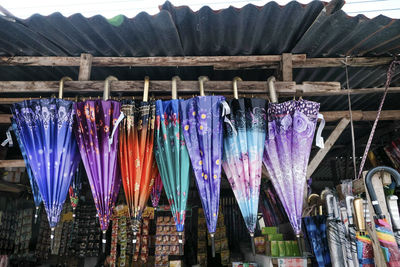 Multi colored flags hanging at market stall