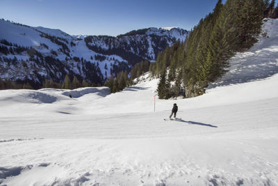 Man standing on snow covered landscape