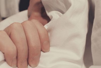 Close-up of man holding blanket