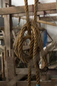 Close-up of rope tied on wood