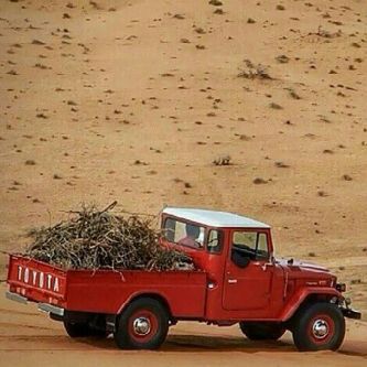 transportation, land vehicle, car, mode of transport, red, sand, street, road, stationary, outdoors, no people, travel, beach, day, parking, high angle view, sunlight, parked, sky, parking lot