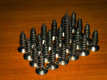 High angle view of screws on table