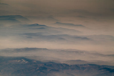 Scenic view of mountains against sky during winter