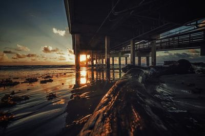 Scenic view of beach against sky during sunset
