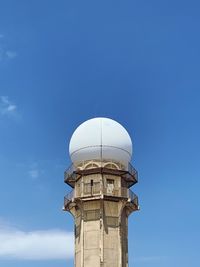 Low angle view of building against clear blue sky