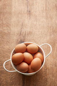 Close-up of eggs in basket on table