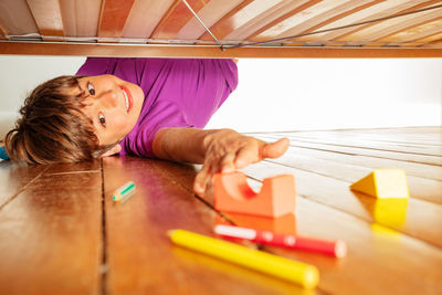 High angle view of girl playing with toy