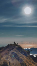 Scenic view of land against sky during sunset