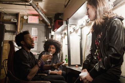 Young people hanging out backstage at a theater