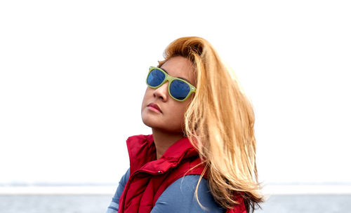 Portrait of young woman wearing sunglasses