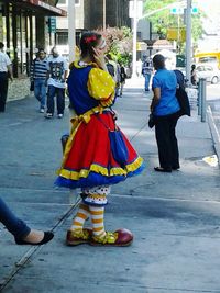 Full length of woman standing in park