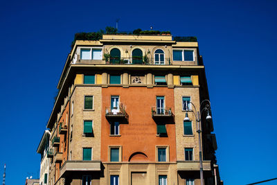 Low angle view of building against blue sky