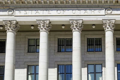 The architecture of buildings windows, stucco molding, and columns on a sunny day in the usa