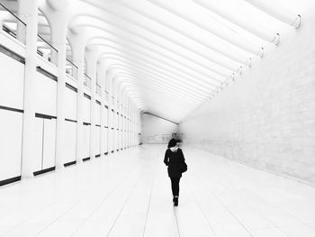 Woman walking in corridor