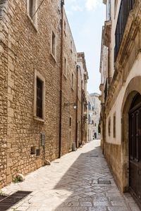 Narrow alley amidst buildings in city