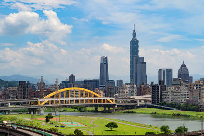 View of buildings against cloudy sky