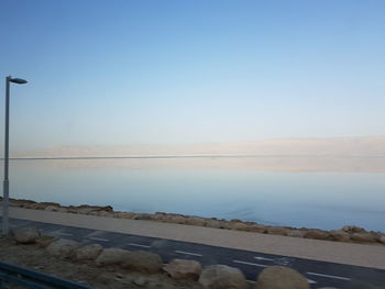 Scenic view of sea against clear blue sky