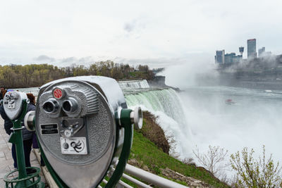 Scenic view of river against cloudy sky