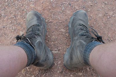 Low section of man standing outdoors