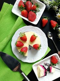 High angle view of strawberries in bowl on table