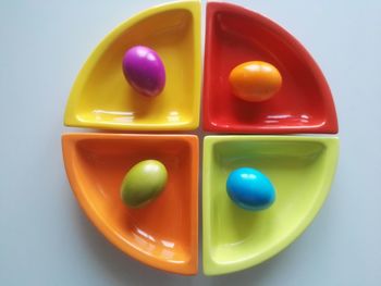 High angle view of multi colored candies on white background