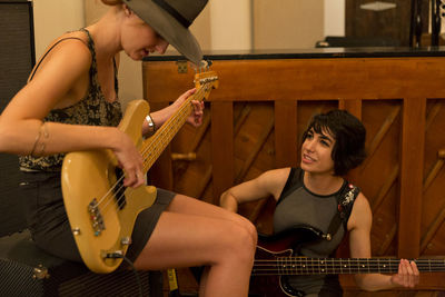 Young musicians practicing at a rehearsal space