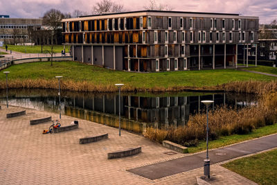 High angle view of buildings by lake