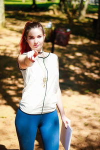 Young woman standing in park