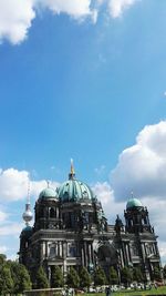 Low angle view of church against cloudy sky