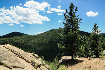 Scenic view of mountains against cloudy sky