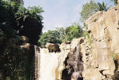 Panoramic view of waterfall against sky