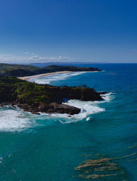 Scenic view of sea against blue sky